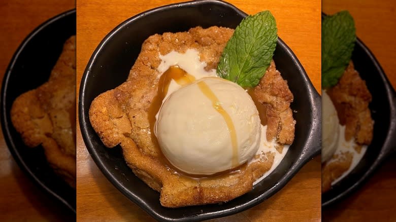 Cookie and ice cream scoop in skillet