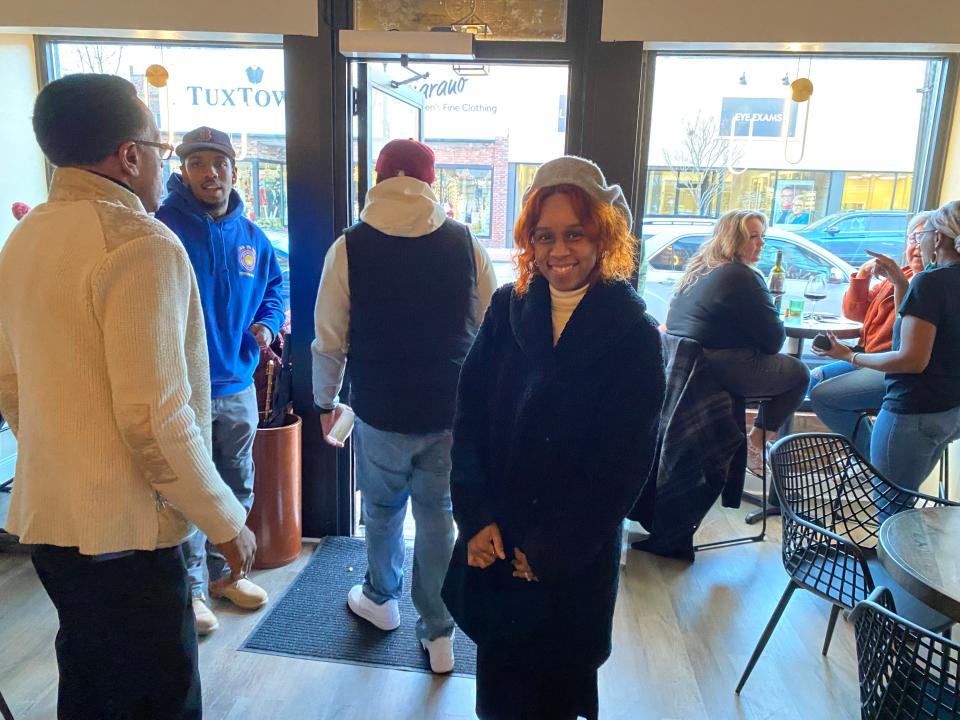 Owner Talisa Proctor soaks in the moment at the official ribbon cutting of her new wine bar, Talisa's on Main in downtown Taunton on Thursday, Jan. 4, 2024.