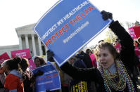 Lisa Dowling, from Arlington, Va., a supporter of health care reform, rallies in front of the Supreme Court.