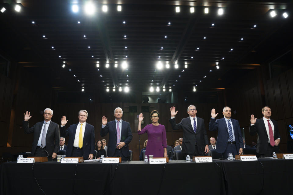 From left, Wells Fargo & Company CEO and President Charles Scharf, Bank of America Chairman and CEO Brian Thomas Moynihan, JPMorgan Chase & Company Chairman and CEO Jamie Dimon, Citigroup CEO Jane Fraser, Truist Financial Corporation Chairman and CEO William Rogers Jr., U.S. Bancorp Chairman, President, and CEO Andy Cecere, and The PNC Financial Services Group Chairman, President, and CEO William Demchak, are sworn-in to testify at a Senate Banking Committee annual Wall Street oversight hearing, Thursday, Sept. 22, 2022, on Capitol Hill in Washington. (AP Photo/Jacquelyn Martin)