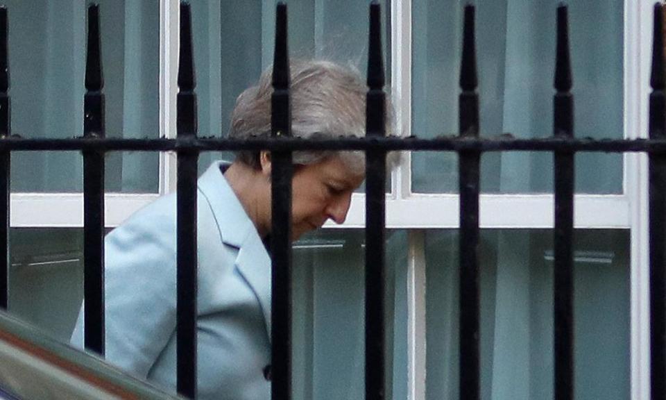 Theresa May arrives at the back entrance of 10 Downing Street in London