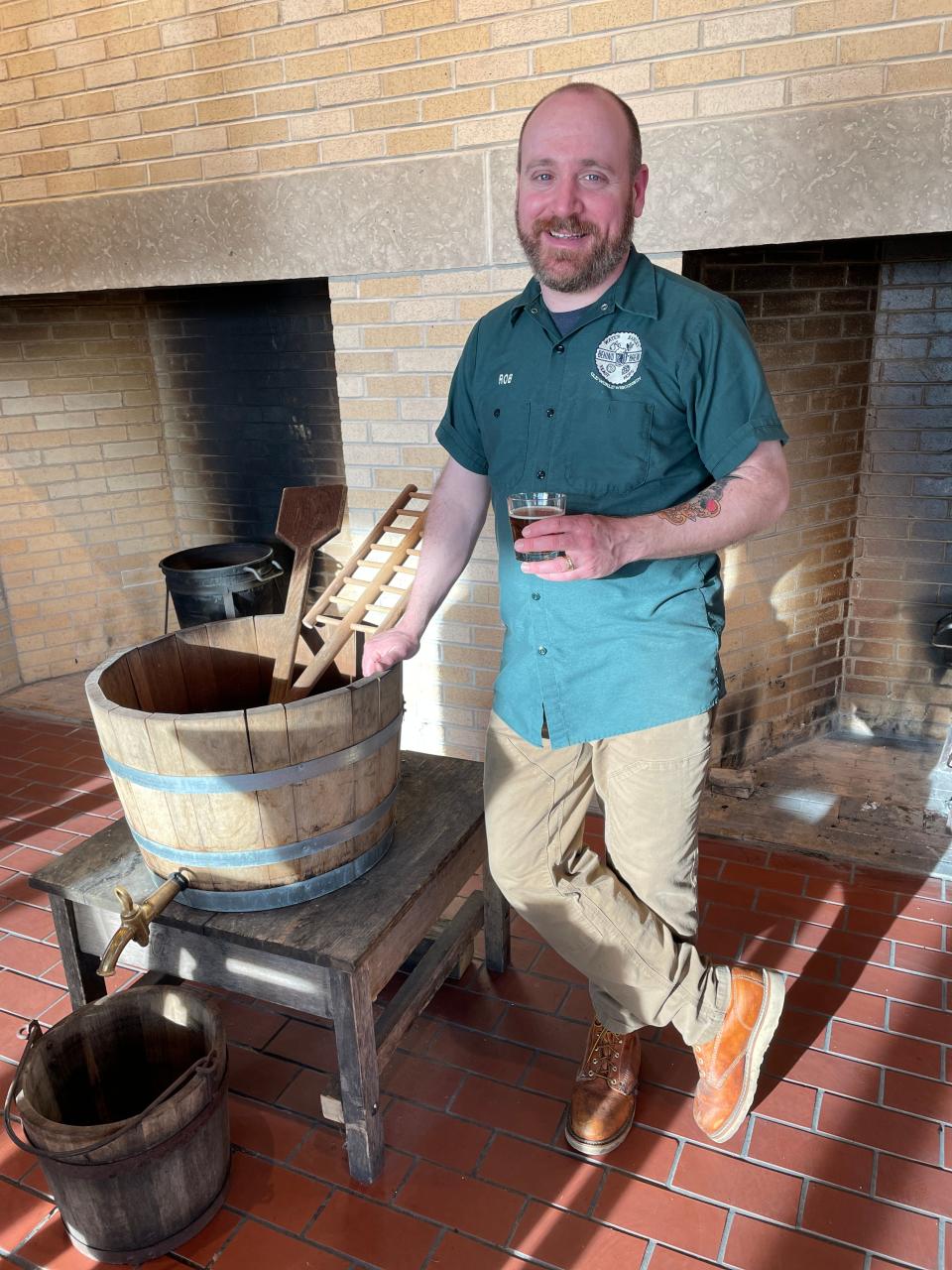 Old World Wisconsin Brewmaster Rob Novak stands in the brewhouse where he makes beer at the historical site.