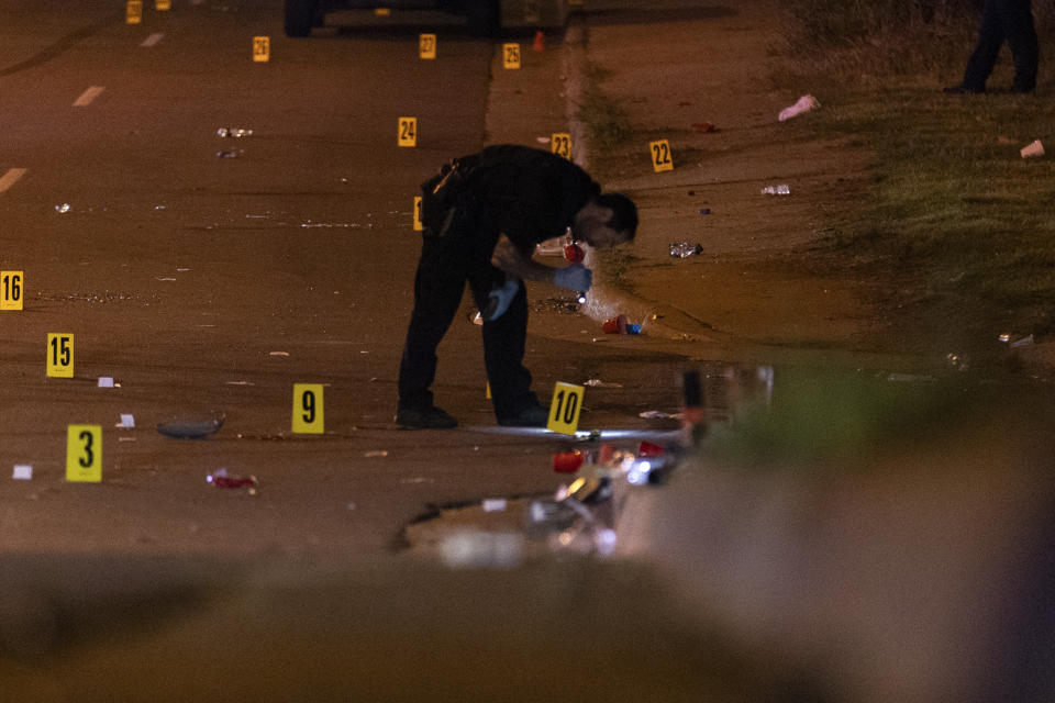 RETRANSMITTING FOR ADDED INSTRUCTIONS This image, courtesy of News 5 Cleveland, shows an officer of the Akron Police Department investigating a shooting that happened overnight in Akron, Ohio, Sunday, June 2, 2024. (Mike Vielhaber/News 5 Cleveland via AP)