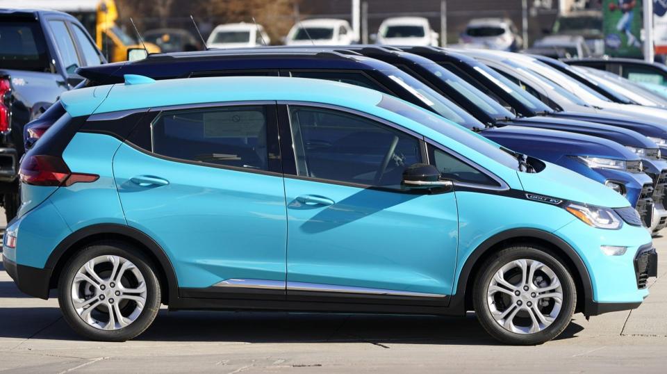 Mandatory Credit: Photo by David Zalubowski/AP/Shutterstock (11008324b)An unsold 2021 Bolt sits at a Chevrolet dealership, in Englewood, ColoNew Car Sales, Englewood, United States - 08 Nov 2020.