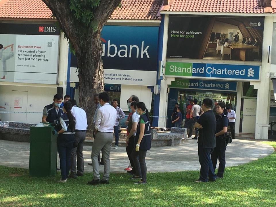 Police officers outside the Standard Chartered Bank branch in Holland Village that was robbed. (File photo: Nicholas Yong/Yahoo News Singapore)