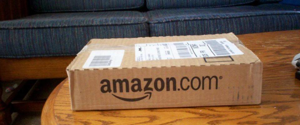 Amazon logo on package sits on table