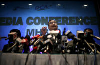 Malaysia's Minister of Transport Hishamuddin Hussein takes questions from the media during a press conference about the missing Malaysia Airlines jetliner MH370, Thursday, March 13, 2014, in Sepang, Malaysia. Planes sent Thursday to check the spot where Chinese satellite images showed possible debris from the missing Malaysian jetliner found nothing, Malaysia's civil aviation chief said, deflating the latest lead in the six-day hunt. The hunt for the missing Malaysia Airlines flight 370 has been punctuated by false leads since it disappeared with 239 people aboard about an hour after leaving Kuala Lumpur for Beijing early Saturday. (AP Photo/Wong Maye-E)