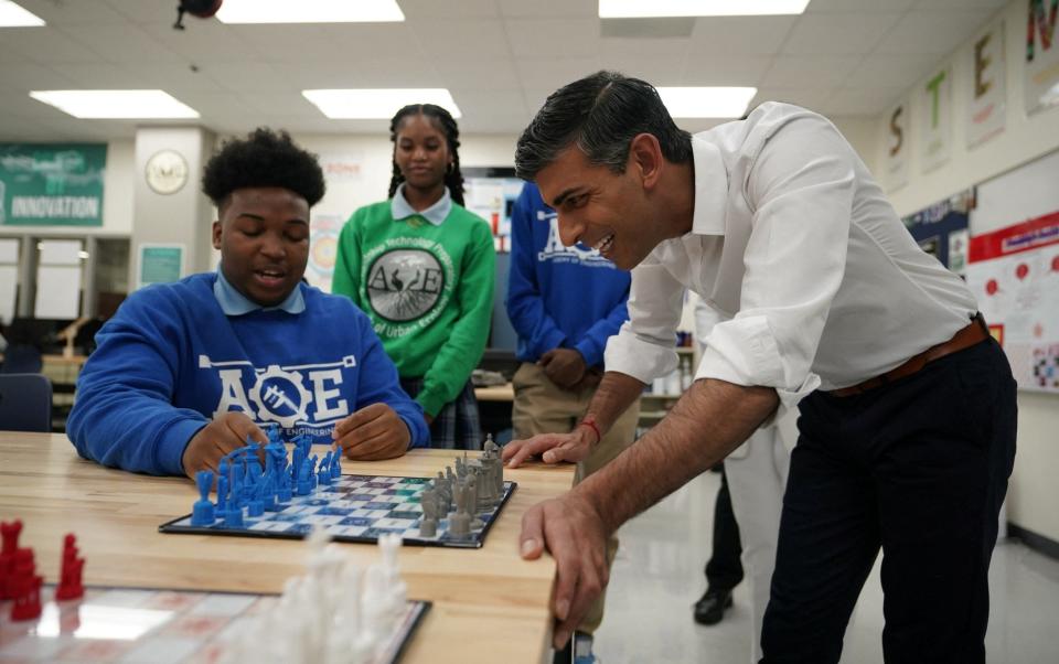 Mr Sunak met students on a visit to the Friendship Technology Preparatory High School in DC - REUTERS