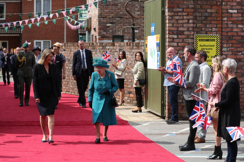 Britain's Queen Elizabeth II visits the set of the long running television series Coronation Street, in Manchester, England, Thursday July 8, 2021. (AP Photo/Scott Heppell)