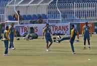 Pakistan player Babar Azam, right, Imad Wasim, second right, Imam-ul-Haq, center, and others play soccer prior to practice session at the Pindi Cricket Stadium, in Rawalpindi, Pakistan, Thursday, Oct. 29, 2020. The Zimbabwe cricket team is in Pakistan to play three ODIs and three Twenty20 International match series, beginning with the first ODI on Friday. (AP Photo/Anjum Naveed)