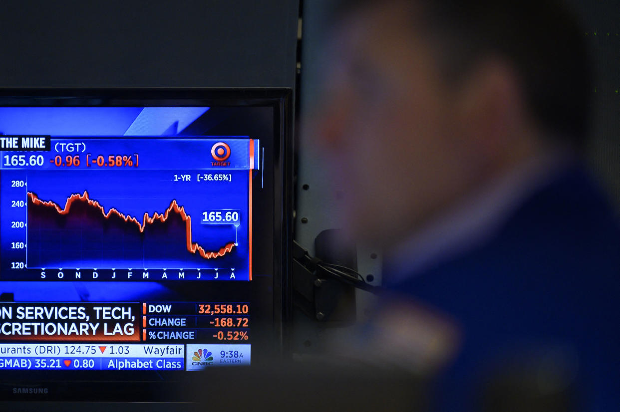 FTSE 100 A trader works on the floor of the New York Stock Exchange (NYSE) at the opening bell on August 5, 2022 at Wall Street in New York City. - Stock markets slid Friday as a much stronger-than-expected US jobs report raised the prospect that the Federal Reserve will maintain its aggressive monetary policy to combat inflation. (Photo by ANGELA WEISS / AFP) (Photo by ANGELA WEISS/AFP via Getty Images)