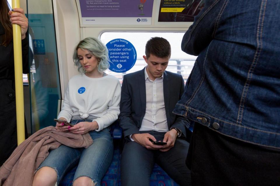 The 'look up' campaign runs alongside the 'Please Offer Me a Seat' badge initiative (Transport for London)