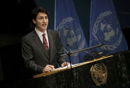 Canadian Prime Minister Justin Trudeau delivers his remarks during the signing ceremony on climate change held at the United Nations Headquarters in Manhattan, New York, U.S., April 22, 2016. REUTERS/Carlo Allegri