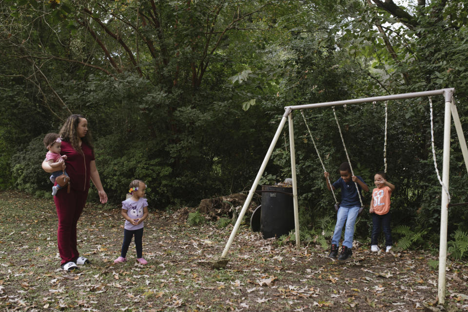 Ashley Brown with her children at their home in Carrollton, Miss. (Lucy Garrett / Lucy Garrett for NBC News)