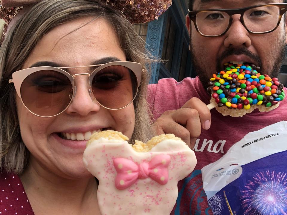 dana and her partner posing with disney rice crispy treats