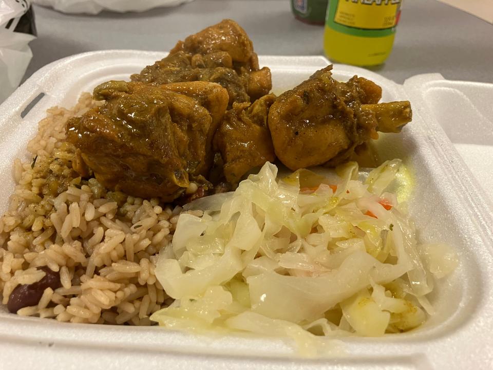 Brown stew chicken with rice and cabbage is a tender and tasty entrée option at Jamaican Jerk Center in Akron's Chapel Hill neighborhood.