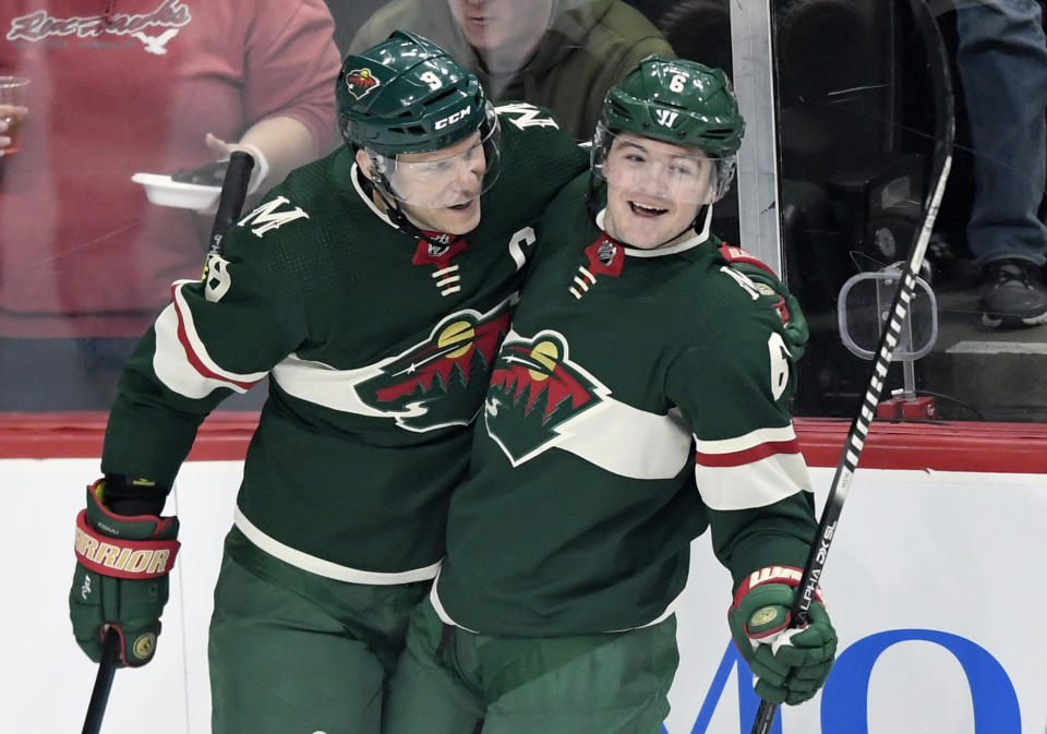 Minnesota Wild's Mikko Koivu (9), of Finland, and Ryan Donato (6) celebrate a goal by Donato against the Washington Capitals during the first period of an NHL hockey game Sunday, March 1, 2020, in St. Paul, Minn. (AP Photo/Hannah Foslien)