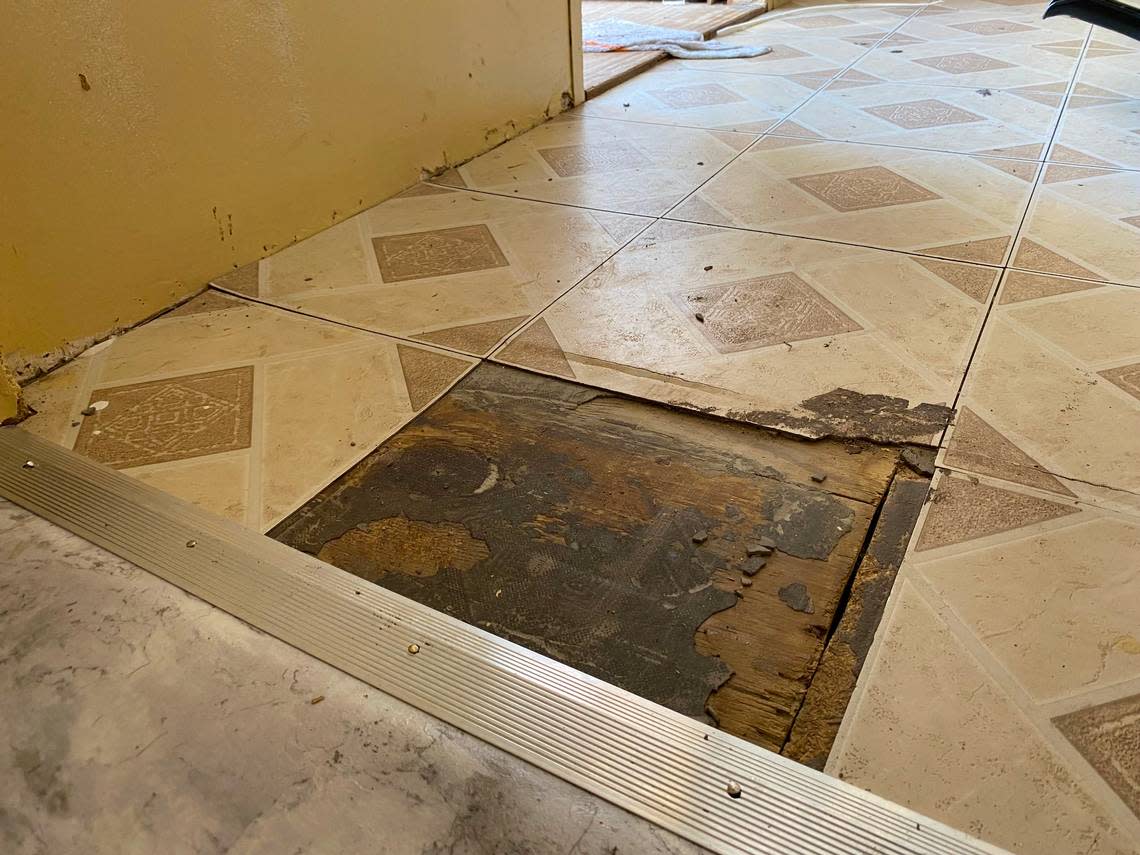 A piece of pulled-up flooring in Audrey Hamilton’s home. Three parts of her three-bedroom mobile home have needed floor replacement. The Deep Well Project has helped Hamilton for about the past decade with needed repairs that are in part from environmental causes.