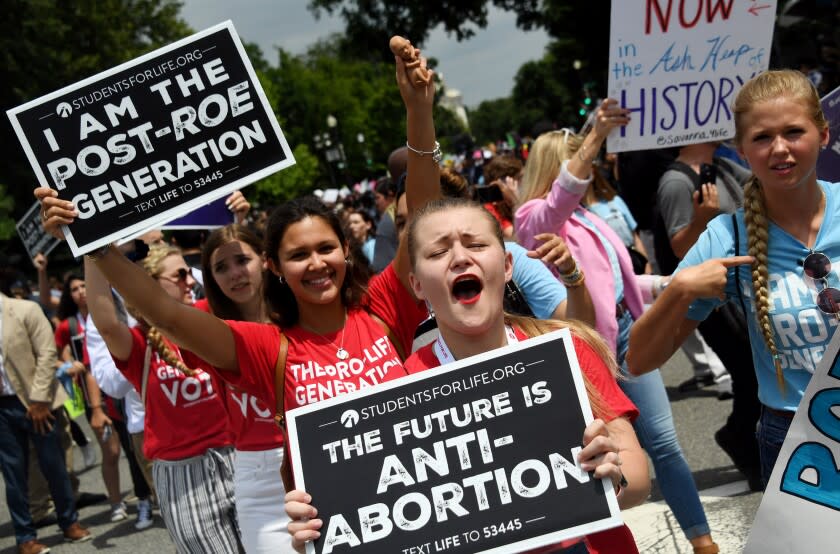 Anti-abortion campaigners celebrate in the streets of Washington, DC, on June 24, 2022. - The US Supreme Court on Friday ended the right to abortion in a seismic ruling that shreds half a century of constitutional protections on one of the most divisive and bitterly fought issues in American political life. The conservative-dominated court overturned the landmark 1973 "Roe v Wade" decision that enshrined a woman's right to an abortion and said individual states can permit or restrict the procedure themselves. (Photo by OLIVIER DOULIERY / AFP) (Photo by OLIVIER DOULIERY/AFP via Getty Images)