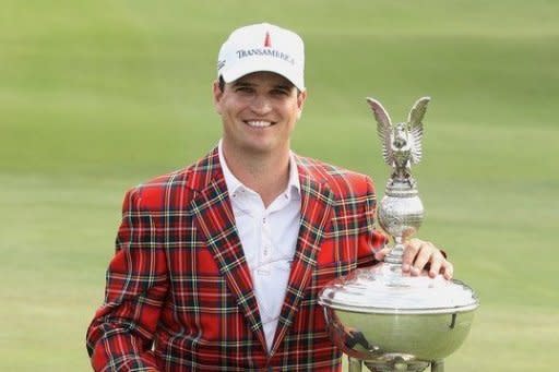 Zach Johnson poses with the trophy after his one-stroke victory at the Crowne Plaza Invitational at Colonial at the Colonial Country Club in Fort Worth, Texas, on May 27. Johnson fired a two-over 72 that included a two-shot penalty at the final hole to win the event, denying Jason Dufner a third US PGA victory this season