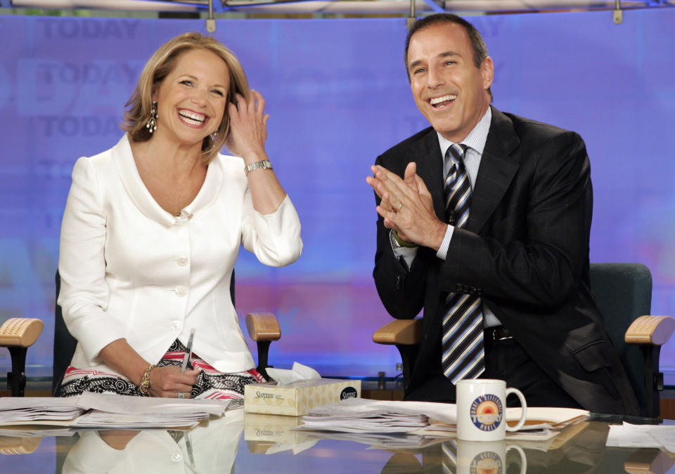 FILE - Katie Couric, left, and Matt Lauer, co-hosts of the NBC "Today" program, open her farewell broadcast in New York on May 31, 2006. Couric has a new book "Going There" out on Oct. 26. (AP Photo/Richard Drew, File)