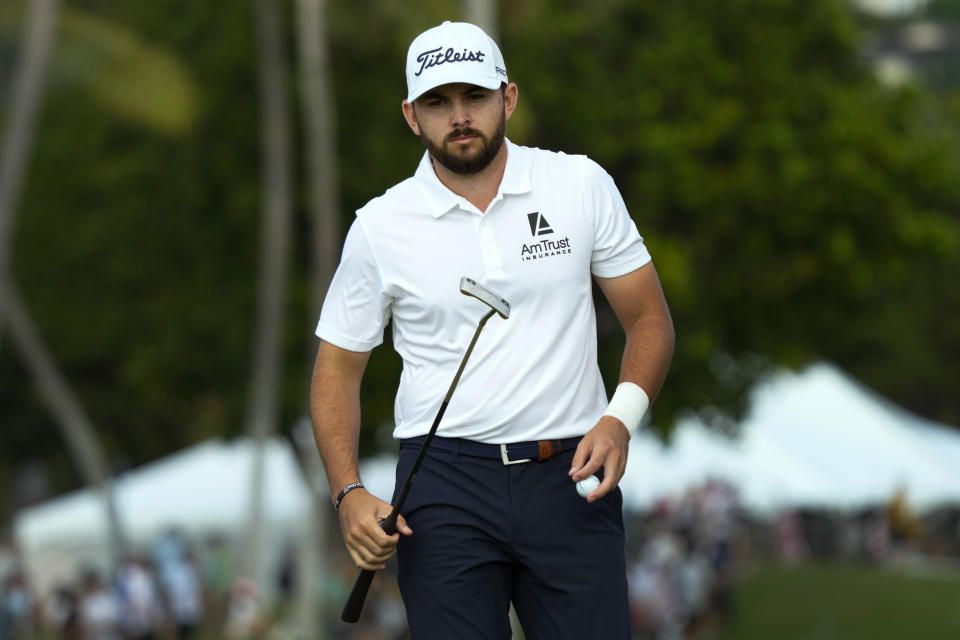 Hayden Buckley walks off the 18th green after making his putt during the third round of the Sony Open golf tournament, Saturday, Jan. 14, 2023, at Waialae Country Club in Honolulu. (AP Photo/Matt York)