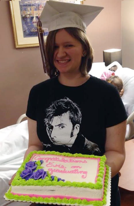 In this Monday, April 21, 2014 photo courtesy of Evie Shumaker, 17-year-old Evie Shumaker, of Newport, Ohio, displays her cake after a special graduation ceremony in her mother's room at Licking Memorial Hospital in Newark, Ohio. Evie's mother, Melissa Shumaker has late-stage, inoperable pancreatic cancer, and Evie's teachers decided to award her a diploma early so her mother could see her graduate. (AP Photo/Courtesy Evie Shumaker)