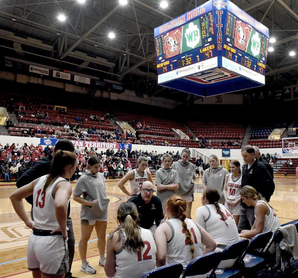 Bedford girls basketball coach Bill Ryan talks with his players near the end of the third quarter during a 54-32 loss to West Bloomfield in the Division 1 state quarterfinals at the University of Detroit's Mercy Calihan Hall on Tuesday, March 19, 2024.