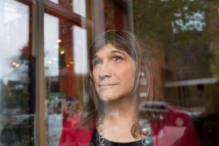 Vermont Democratic Party gubernatorial primary candidate Christine Hallquist, a transgender woman, poses on College Street in Burlington, Vermont, U.S., August 8, 2018. Picture taken August 8, 2018. REUTERS/Caleb Kenna