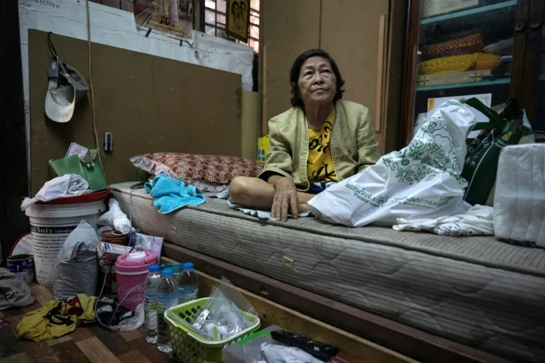 Chusri Kaewkhio, 73, lives with her 75-year-old husband Suchart in Bangkok's Klong Toey slum. She has called for the government to provide more support as the cost of living soars (Lillian SUWANRUMPHA)