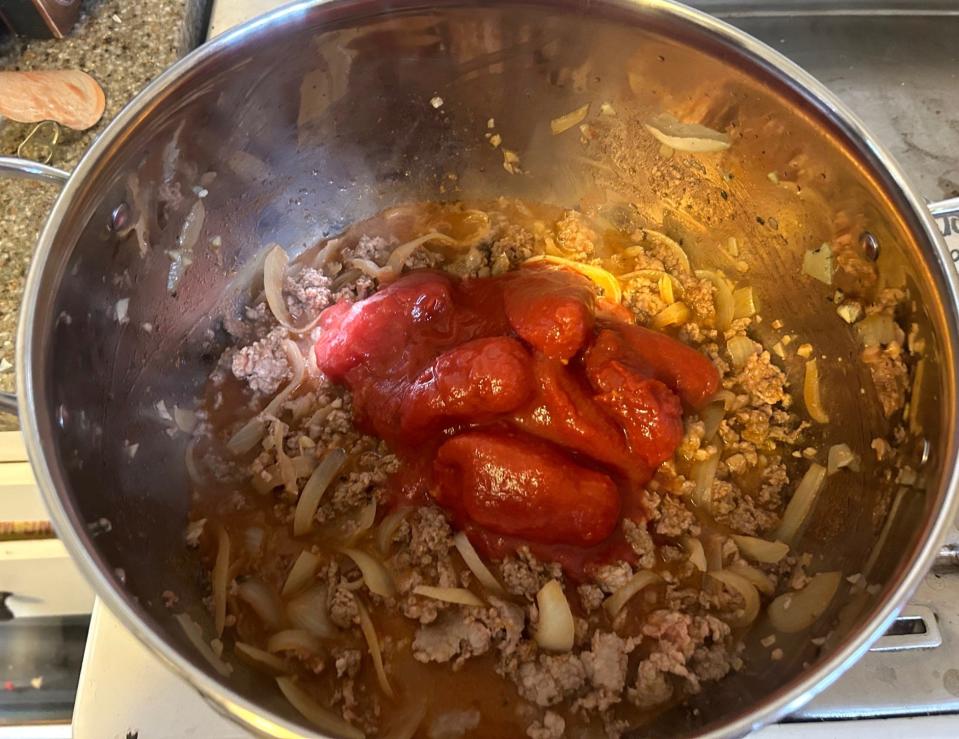 Adding tomatoes to Pioneer Woman's Lasagna Soup