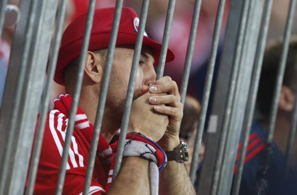 A Bayern Munich' fan watches the Champion's League semi-final second leg soccer match against Real Madrid in Munich