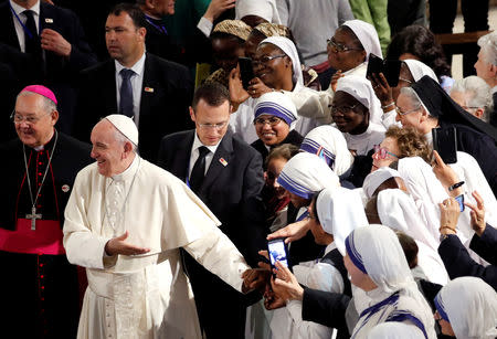 Pope Francis greets the faithful as he leaves Saint Peter's Cathedral in Rabat, Morocco, March 31, 2019. REUTERS/Remo Casilli