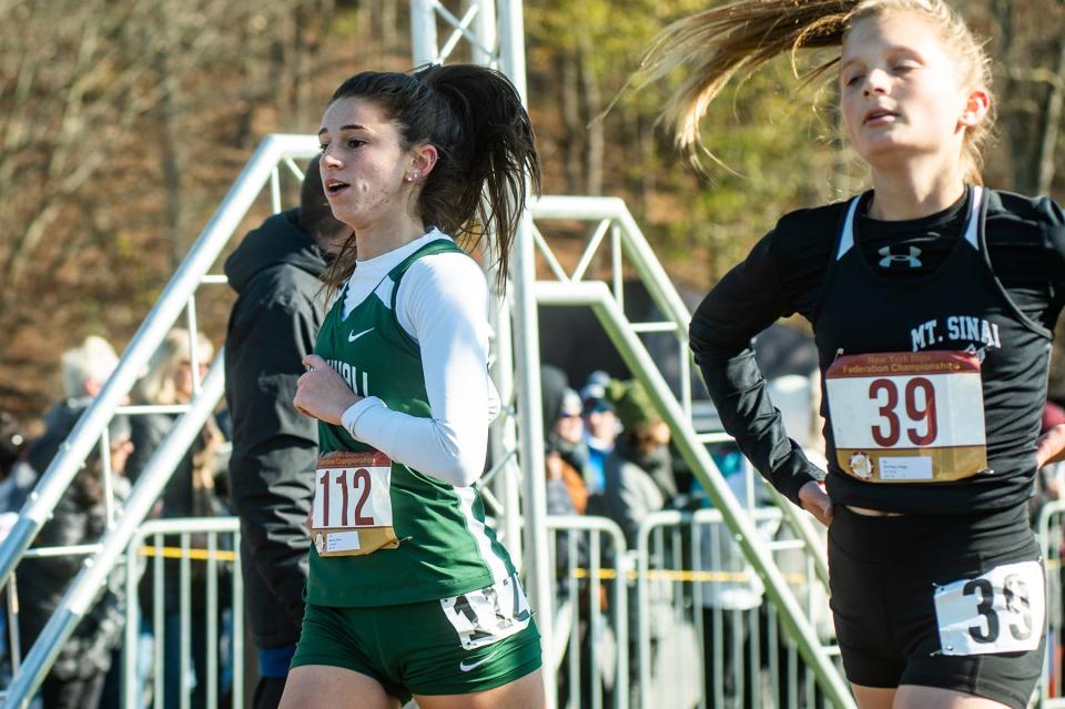 Cornwall's Kerry Murphy runs across the finish line during the New York Federation championship at Bowdoin Park in Poughkeepsie on Saturday, November 19, 2022.