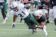 South Florida running back Brian Battie (21) dives for the end zone to score as Houston linebacker Mannie Nunnery, right, tackles during the first half of an NCAA college football game Saturday, Oct. 29, 2022, in Houston. (AP Photo/Michael Wyke)