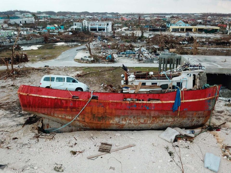 A boat sits grounded in the aftermath of Hurricane Dorian, in Marsh Harbor, Abaco Island, Bahamas, on 6 September 2019 (AP)