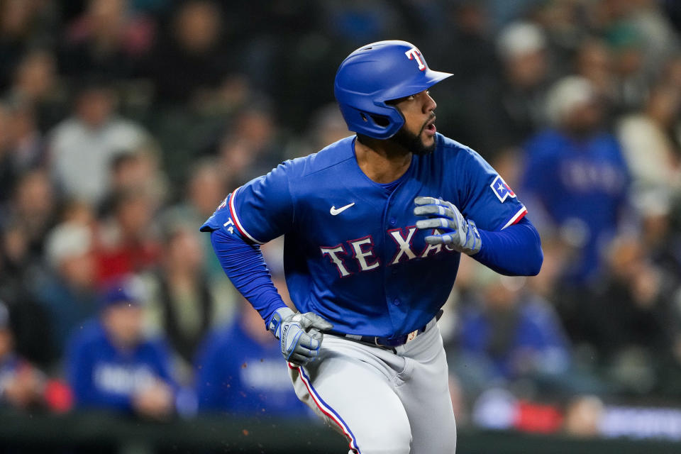 Texas Rangers' Leody Taveras watches his solo home run against the Seattle Mariners during the third inning of a baseball game Thursday, Sept. 28, 2023, in Seattle. (AP Photo/Lindsey Wasson)