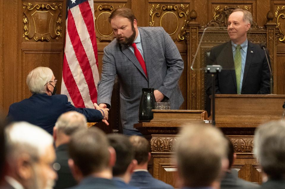 Gov. Tony Evers, left, is greeted by state Rep. Tyler August, R-Lake Geneva, before delivering his State of the State address last February. August is now Assembly majority leader.