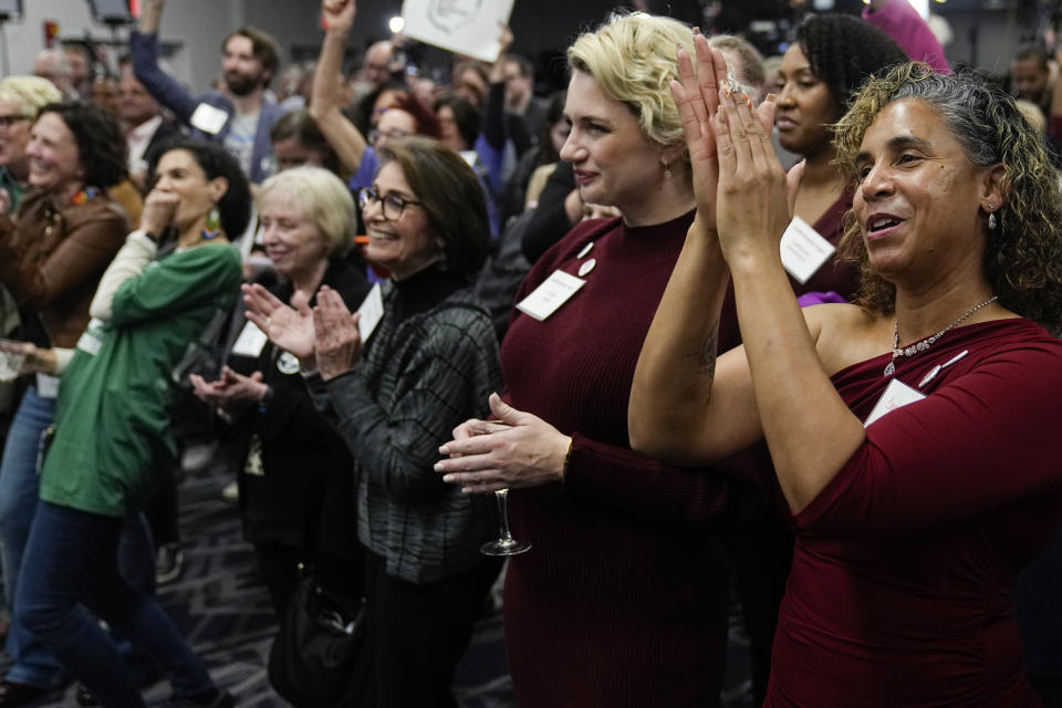 January Belcher, right, cheers at a pro-Issue 1 watch party, Tuesday, Nov. 7, 2023, in Columbus Ohio. Ohio voters have approved a constitutional amendment that guarantees the right to abortion and other forms of reproductive health care. The outcome of Tuesday’s intense, off-year election was the latest blow for abortion opponents. (AP Photo/Sue Ogrocki