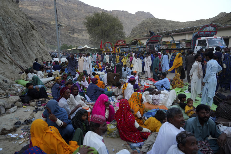 Hindu devotees take rest upon arrival at an ancient cave temple of Hinglaj Mata to attend an annual festival in Hinglaj in Lasbela district in the Pakistan's southwestern Baluchistan province, Friday, April 26, 2024. More than 100,000 Hindus are expected to climb mud volcanoes and steep rocks in southwestern Pakistan as part of a three-day pilgrimage to one of the faith's holiest sites. (AP Photo/Junaid Ahmed)