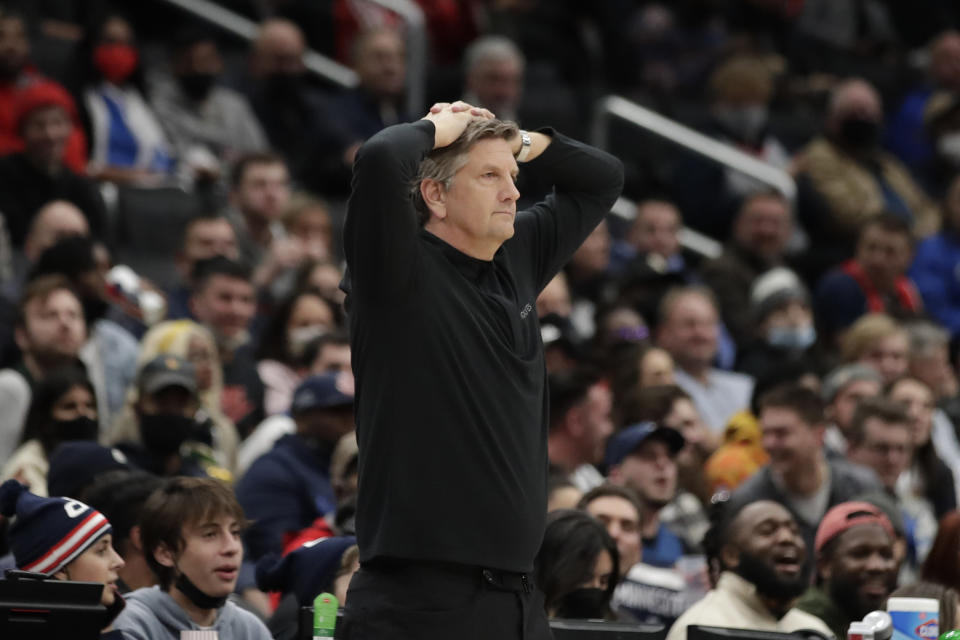 Minnesota Timberwolves coach Chris Finch waches during the first half of the team's NBA basketball game against the Washington Wizards, Wednesday, Dec. 1, 2021, in Washington. (AP Photo/Luis M. Alvarez)