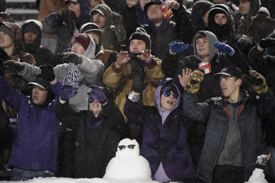 Kansas State fans watch in the snow during the second half of an NCAA college football game against Iowa State Saturday, Nov. 25, 2023, in Manhattan, Kan. Iowa State won 42-35. (AP Photo/Charlie Riedel)