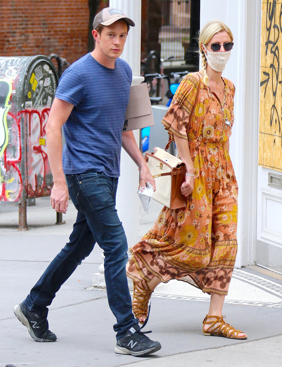 <p>Nicky Hilton Rothschild and husband James Rothschild make their way through N.Y.C.'s SoHo neighborhood on Wednesday.</p>