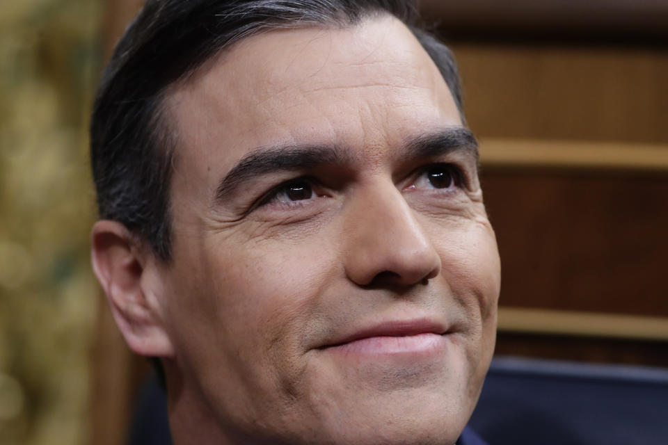 Spain's caretaker Prime Minister Pedro Sanchez sits at the Spanish Parliament in Madrid, Spain, Sunday, Jan. 5, 2020. Sanchez is not expected to clinch an absolute majority during a first round of voting on Sunday but the Socialists insist they have the votes needed to get the required simple majority in a second vote Tuesday to put Sanchez back in the Moncloa Palace. (AP Photo/Manu Fernandez)