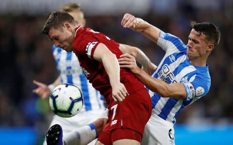 James Milner is lucky not to concede a penalty for handball - Credit: action images