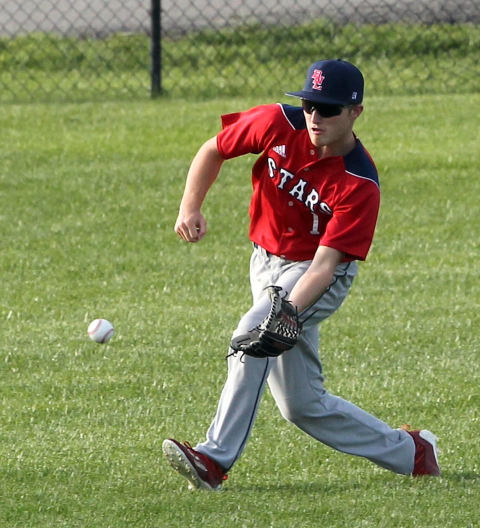 Bedford North Lawrence Left Fielder Trace Rynders (1) fields a bouncer.