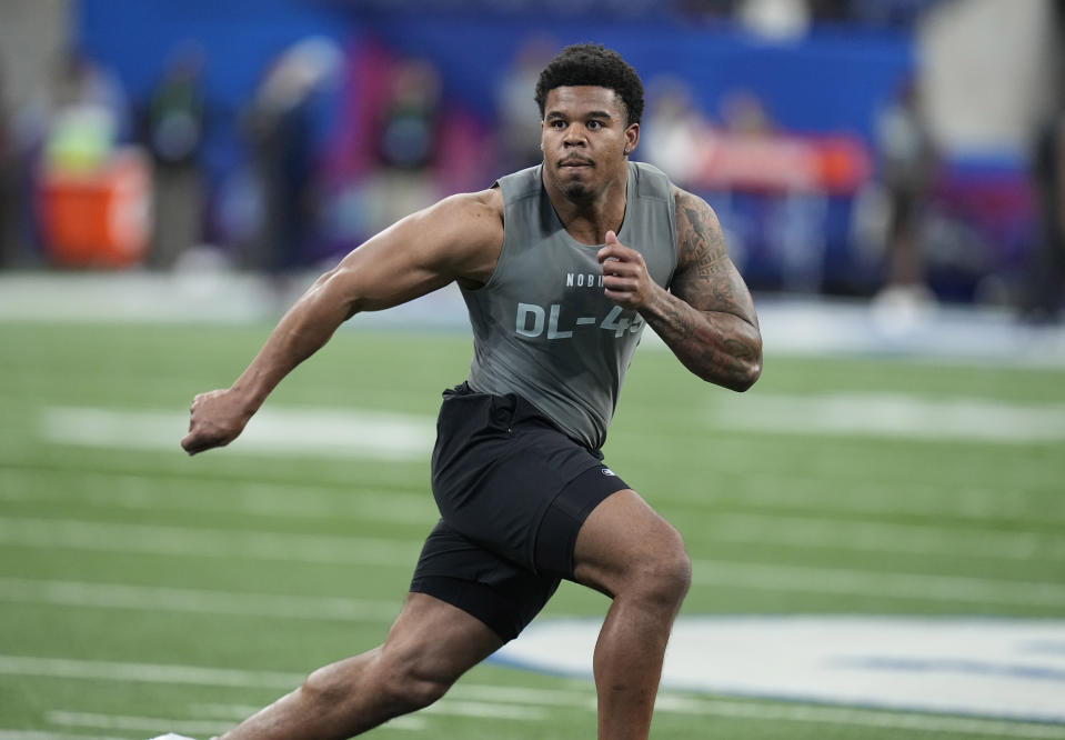 FILE - Penn State defensive lineman Chop Robinson runs a drill at the NFL football scouting combine Feb. 29, 2024, in Indianapolis. The Miami Dolphins selected Robinson with the 21st pick in the NFL draft Thursday night, April 25. (AP Photo/Darron Cummings, File