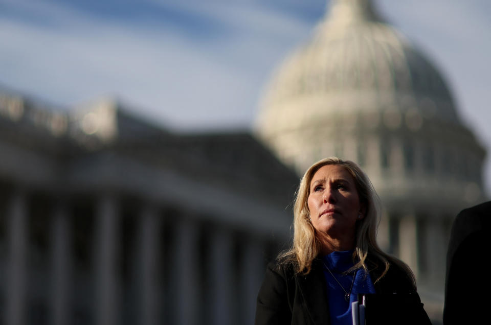 Rep. Marjorie Taylor Greene, R-Ga., listens during a news conference outside the U.S. Capitol in Washington, D.C., in February.