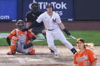 New York Yankees' Luke Voit hits a walkoff RBI sacrifice fly off Baltimore Orioles relief pitcher Hunter Harvey in the 10th inning of a baseball game, Saturday, Sept. 12, 2020, in New York. (AP Photo/John Minchillo)