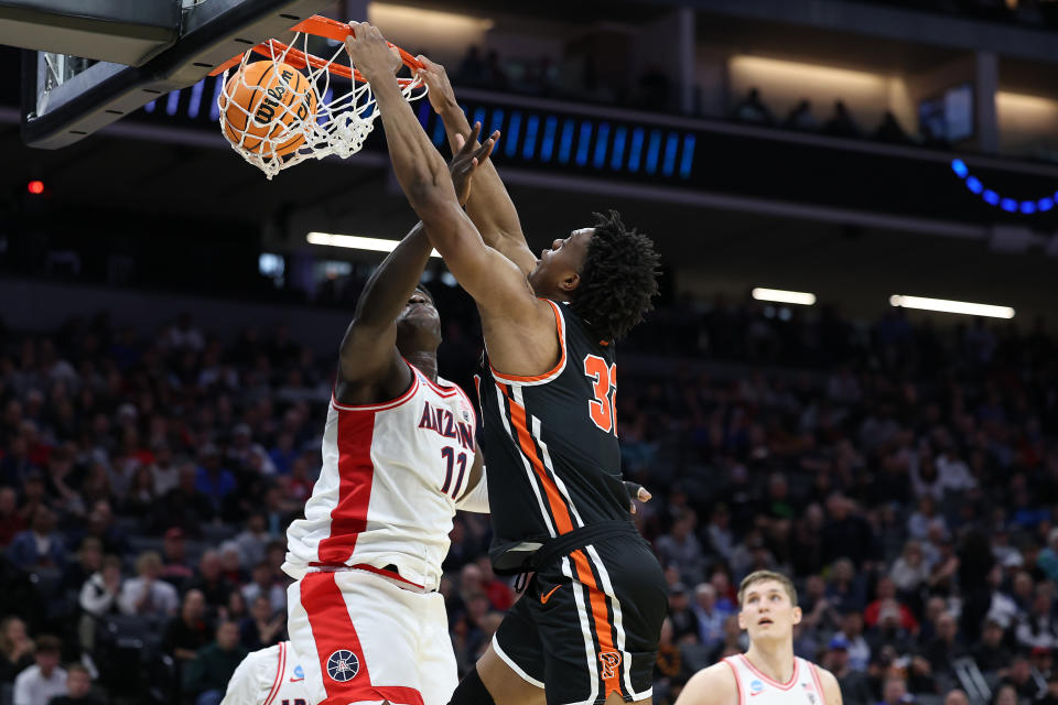 Mar 16, 2023; Sacramento, CA, USA; Princeton Tigers forward Keeshawn Kellman (32) dunks over Arizona Wildcats center Oumar Ballo (11) during the second half at Golden 1 Center. Mandatory Credit: Kelley L Cox-USA TODAY Sports